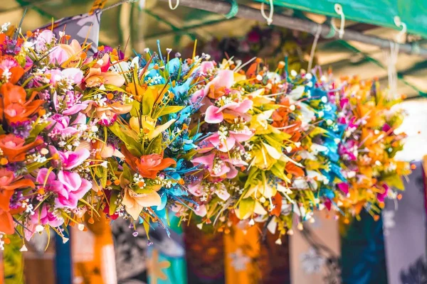 Flower crowns hanging up at the Punanga Nui Market in Rarotonga