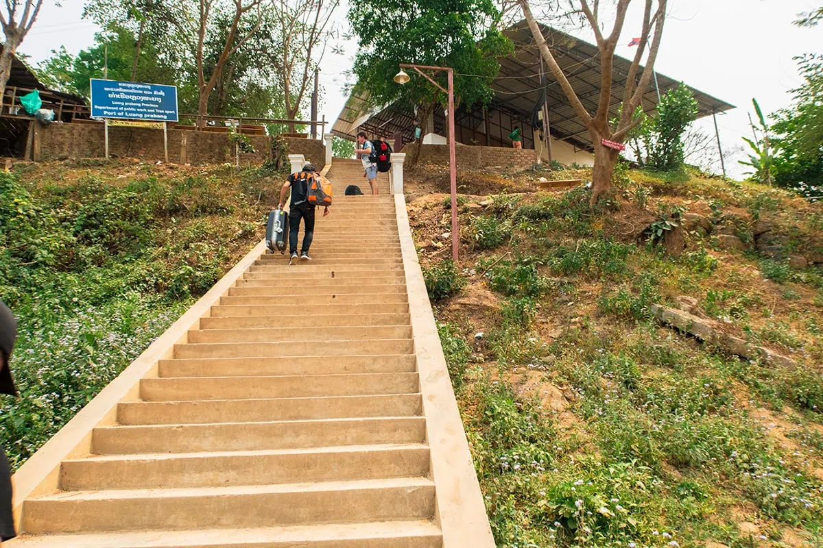 Slow Boat Laos: My Honest Guide After Doing It Twice (2026) 51 Climbing up the steep staircase at the Luang Prabang slow boat pier