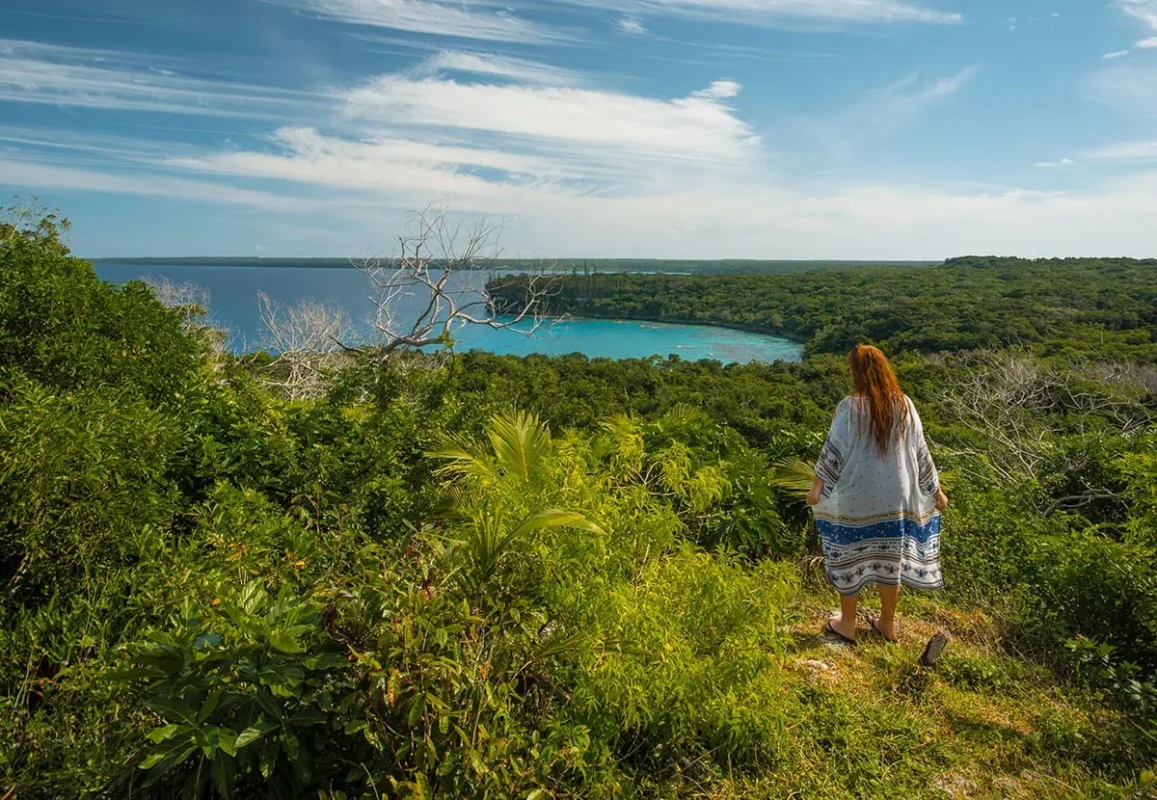 Best Things To Do In Lifou: Beaches, Caves, And Views 12 Tasha Amy standing at a viewpoint, one of the best things to do in Lifou