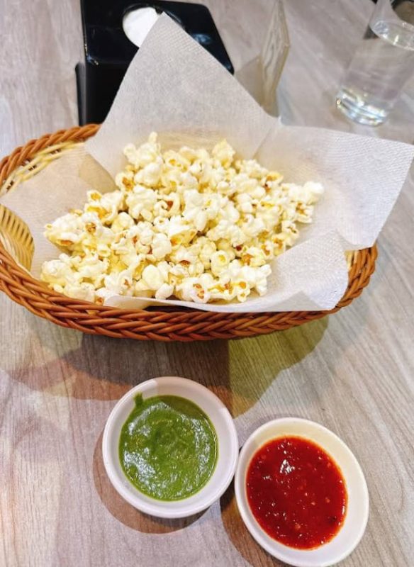 Best Restaurants In Pokhara: Cafes, Cheap Eats & Local Food 32 bowl of popcorn with two dipping sauces at Utopia Garden & Snacks Bar in Pokhara