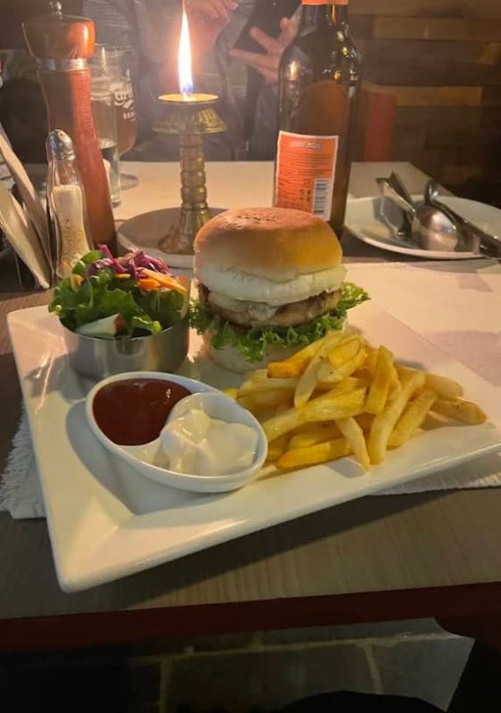 Best Restaurants In Pokhara: Cafes, Cheap Eats & Local Food 38 burger with fries and salad from Rosemarys Kitchen in Pokhara