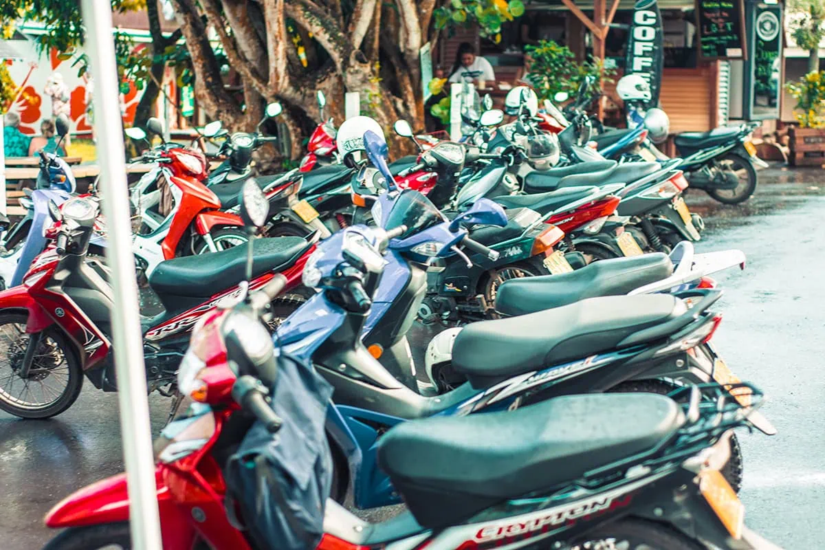 Scooter Hire In Rarotonga: Cost, Requirements, And Tips 24 Scooters parked up at the Punanga Nui Market in Rarotonga