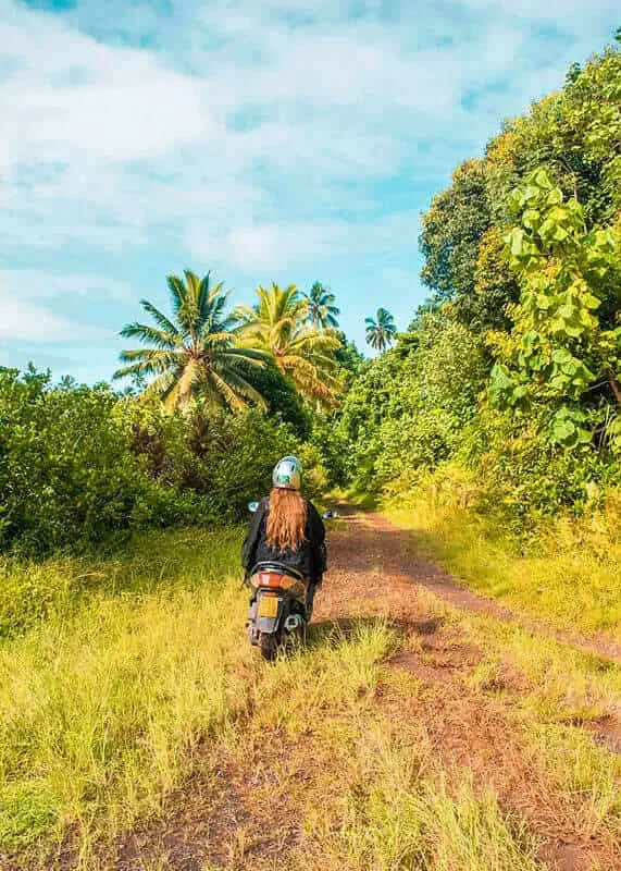 Scooter Hire In Rarotonga: Cost, Requirements, And Tips 18 Tasha Amy on a dirt track with her scooter hire in Rarotonga