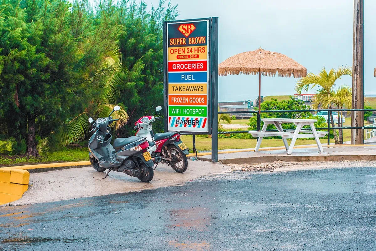 Scooter Hire In Rarotonga: Cost, Requirements, And Tips 16 Two scooters parked up at the petrol station in Rarotonga