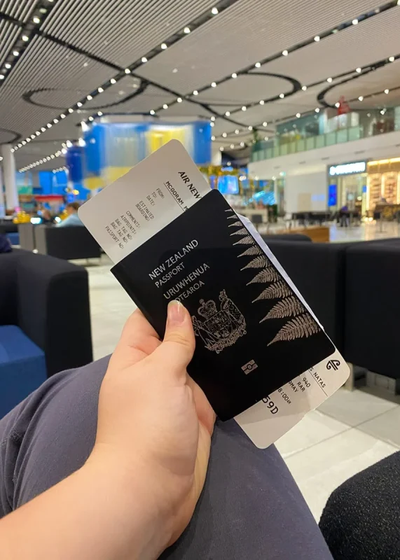 Tourist Scooter License In Rarotonga: Tests, Cost, and What To Expect 18 Tasha Amy sitting at the airport with her New Zealand passport and flight ticket to Rarotonga
