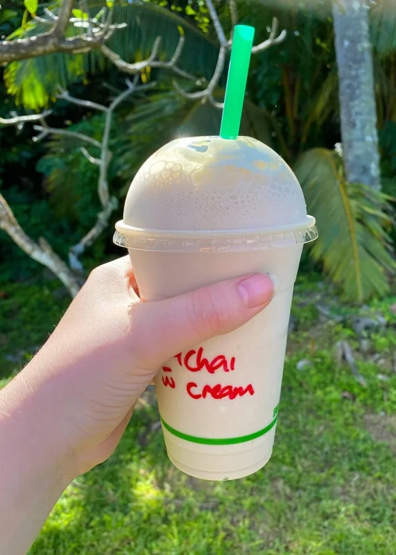 Tourist Scooter License In Rarotonga: Tests, Cost, and What To Expect 19 Tasha Amy holding an iced chai with cream in Rarotonga