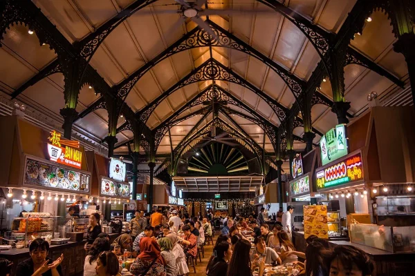 Inside Lau Pa Sat building in Singapore with the evening crowds
