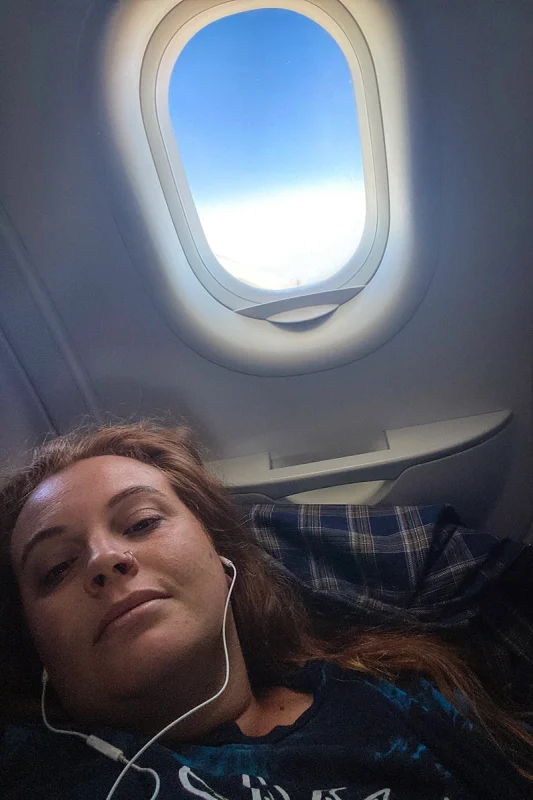 Tasha Amy relaxing on the plane before landing in Singapore