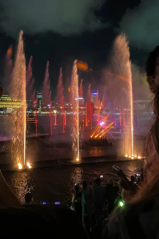 Spectra Light Show Singapore: Times, Best Views & Tips 10 Watching the Spectra Light show from the second level with the fountains shooting up