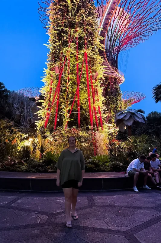 Gardens By The Bay Light Show: Times, Best Viewing Spots & Tips 15 Tasha Amy in front of one of the Supertrees waiting for the Gardens By The Bay Light Show to start