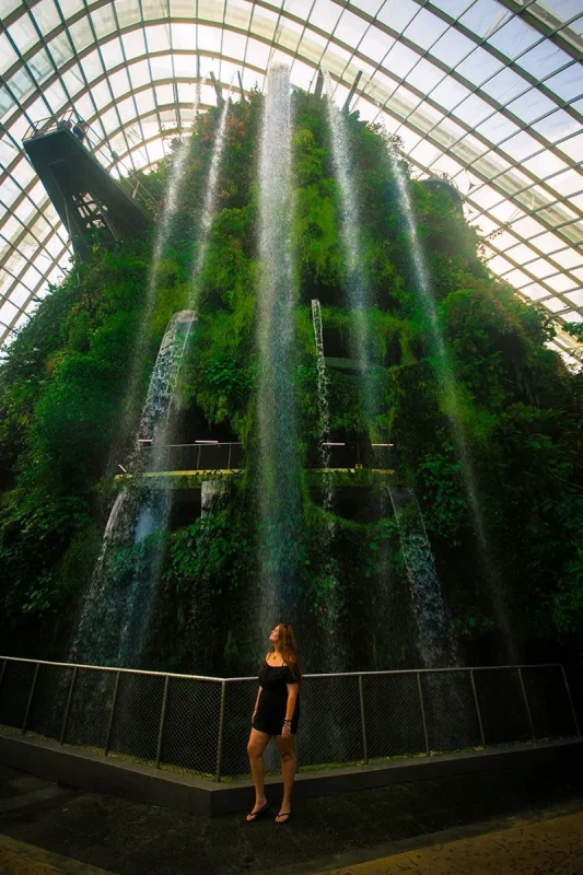 The Perfect 3 Days In Singapore Itinerary For First-Time Visitors 20 Tasha Amy standing in front of the waterfall inside the Cloud Dome at Gardens By The Bay