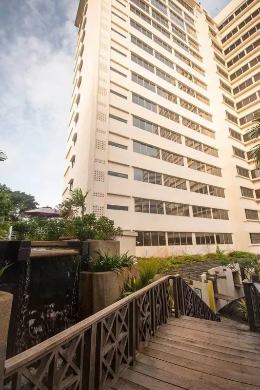 Furama RiverFront Review: What It’s Really Like To Stay Here 11 Wooden walkway and waterfall feature within the Furama RiverFront grounds