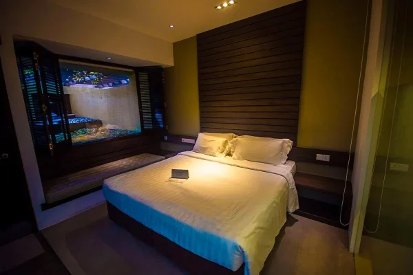 Courtyard Club Room with a double bed and window overlooking the private courtyard