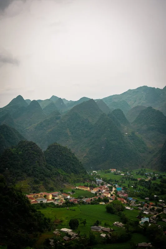 Small village surrounded by green mountains in Ha Giang Province