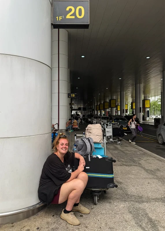 Hanoi Airport To Ha Giang: How To Get There 53 Tasha Amy sitting at column 20 pickup point outside Hanoi Airport International Arrivals