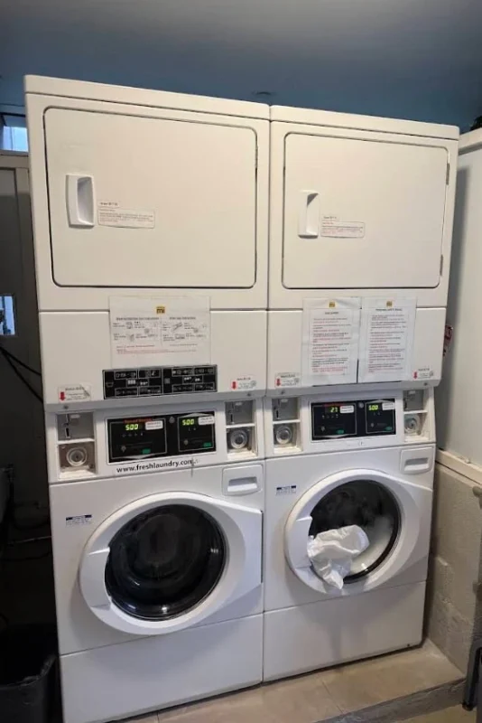 Hotel Mi Rochor Review: Is It Worth Staying Here? (2026) 25 Two dryers and washing machines at Hotel Mi Rochor