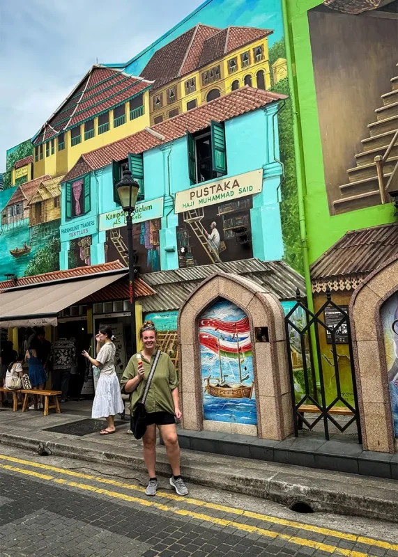 Hotel Mi Rochor Review: Is It Worth Staying Here? (2026) 28 Tasha Amy standing in front of a mural at Kampong Glam