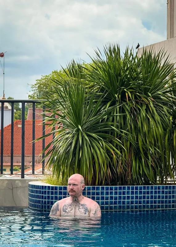 Hotel Mi Rochor Review: Is It Worth Staying Here? (2026) 24 A man in the pool at Hotel Mi Rochor