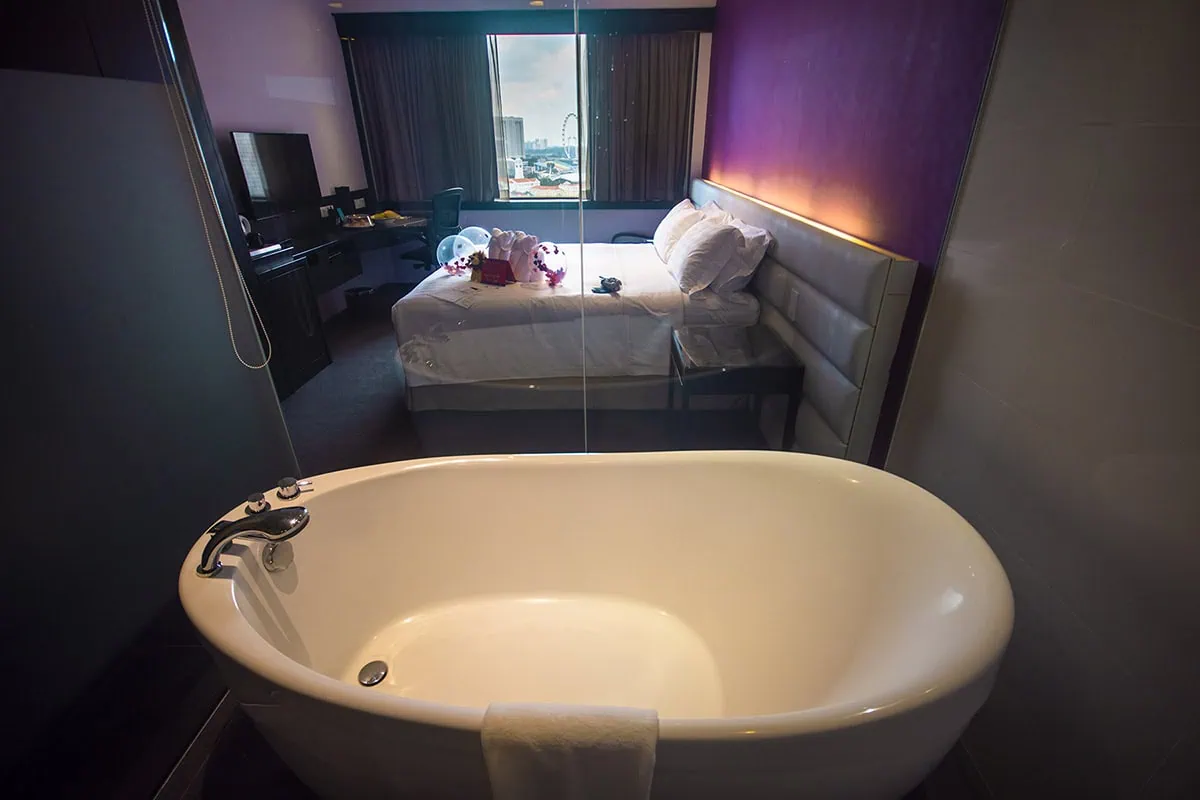 Where To Stay In Singapore: The 6 Best Areas & Hotels 23 Bathtub and bedroom at Furama City Centre Singapore