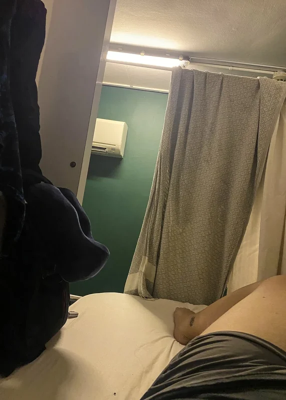 Where To Stay In Singapore: The 6 Best Areas & Hotels 22 Sitting in my pod dorm bed at Wink Hostel on Mosque Street in Chinatown