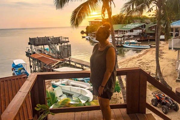 Tasha Amy watching the sunset, one of the best things to do in Roatan, Honduras
