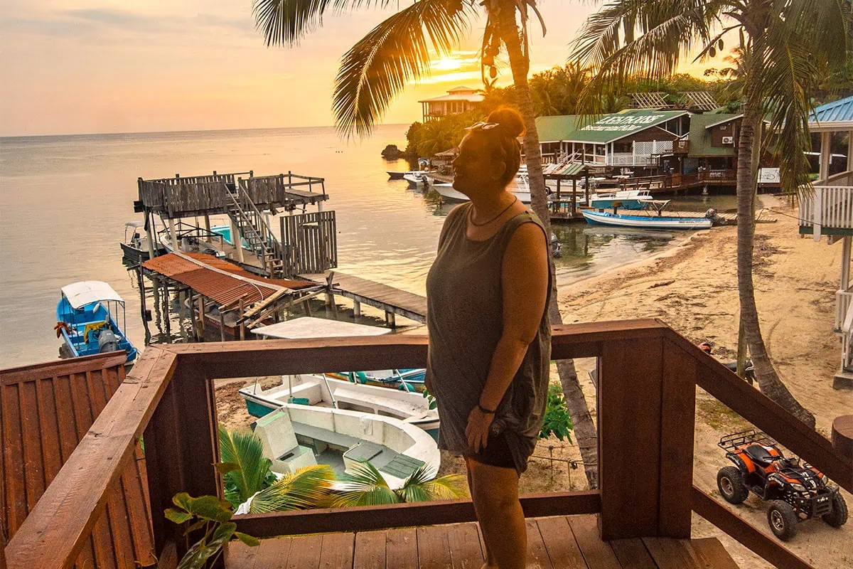 Tasha Amy watching the sunset, one of the best things to do in Roatan, Honduras