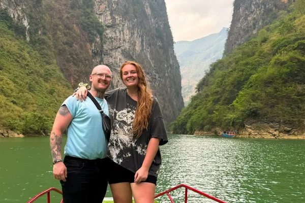 Tasha Amy and Cory on a Nho Que River boat ride beneath the cliffs of Tu San Canyon
