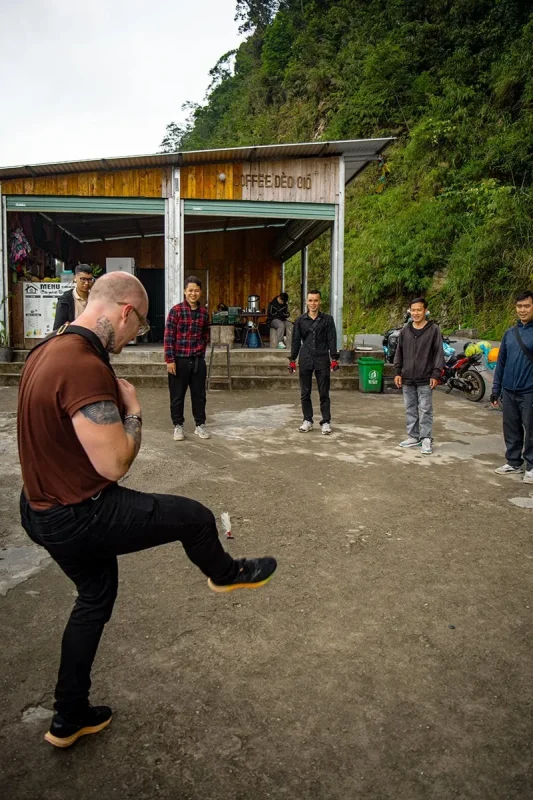 Road Kings travelers and Easy Riders playing Da Cau during a coffee stop